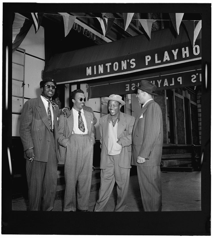 Black and white portrait of Thelonious Monk, Howard McGhee, Roy Eldridge, and Teddy Hill outside of Minton&