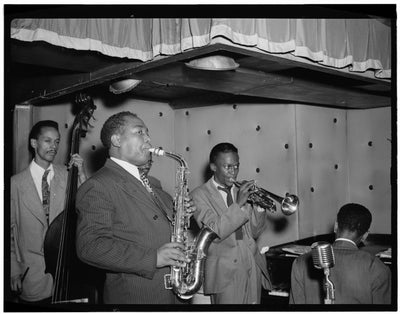 Black and white portrait of Charlie Parker, Tommy Potter, Miles Davis, Duke Jordan, and Max Roach playing at Three Deuces, New York City, N.Y. (1947).