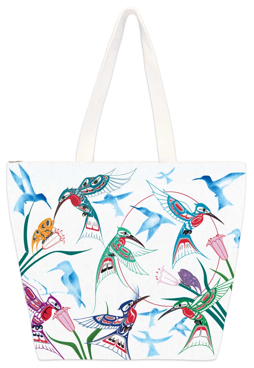 colourful hummingbirds fly around and drink the nectar of flowers. Set on a tote bag.