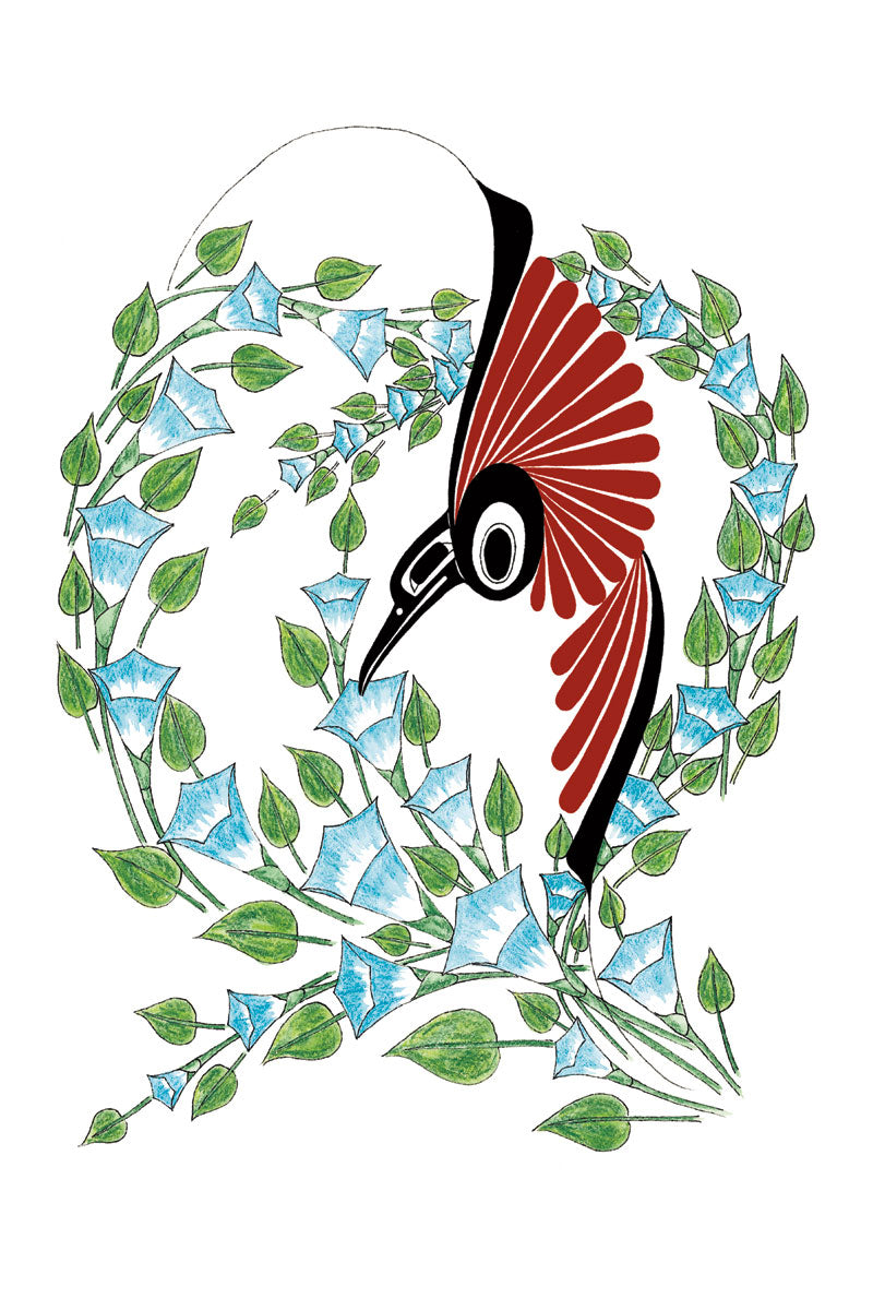 A red hummingbird drinks the nectar from a blue flower. It is surrounded by vines of the same blue flower.