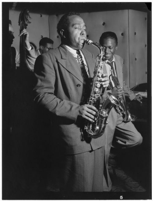 Black and white portrait of Charlie Parker, Tommy Potter, Miles Davis, and Max Roach at Three Deuces in New York City, N.Y. (1947)