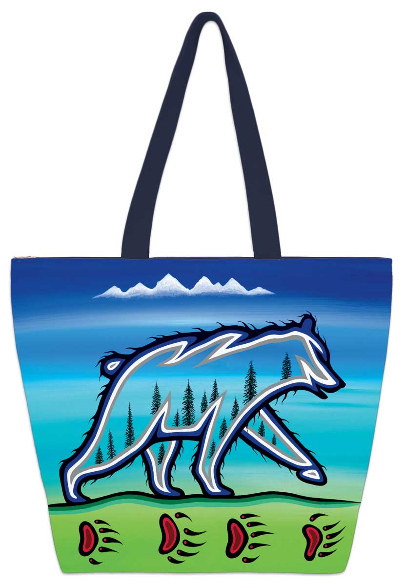 A spectral bear with trees inside it. It walks along ground with bear tracks in it. Set on a tote bag.