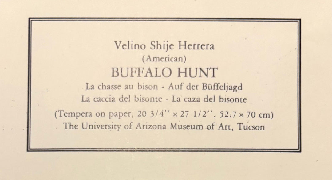 "Close-up of the printed bottom margin of the print reading Velino Shije Herrera, American, Buffalo Hunt, with the title in a second language and the credit line for The University of Arizona Museum of Art, Tucson."