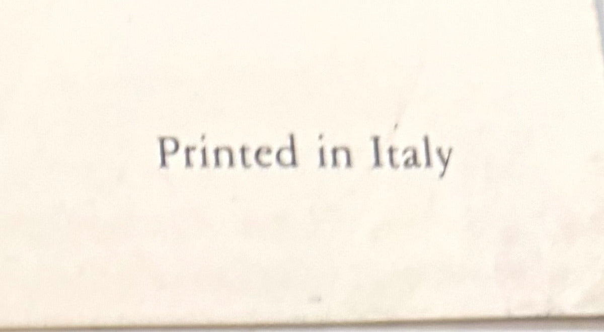 "Close-up of the words Printed in Italy in dark serif type on the cream lower margin of the print."