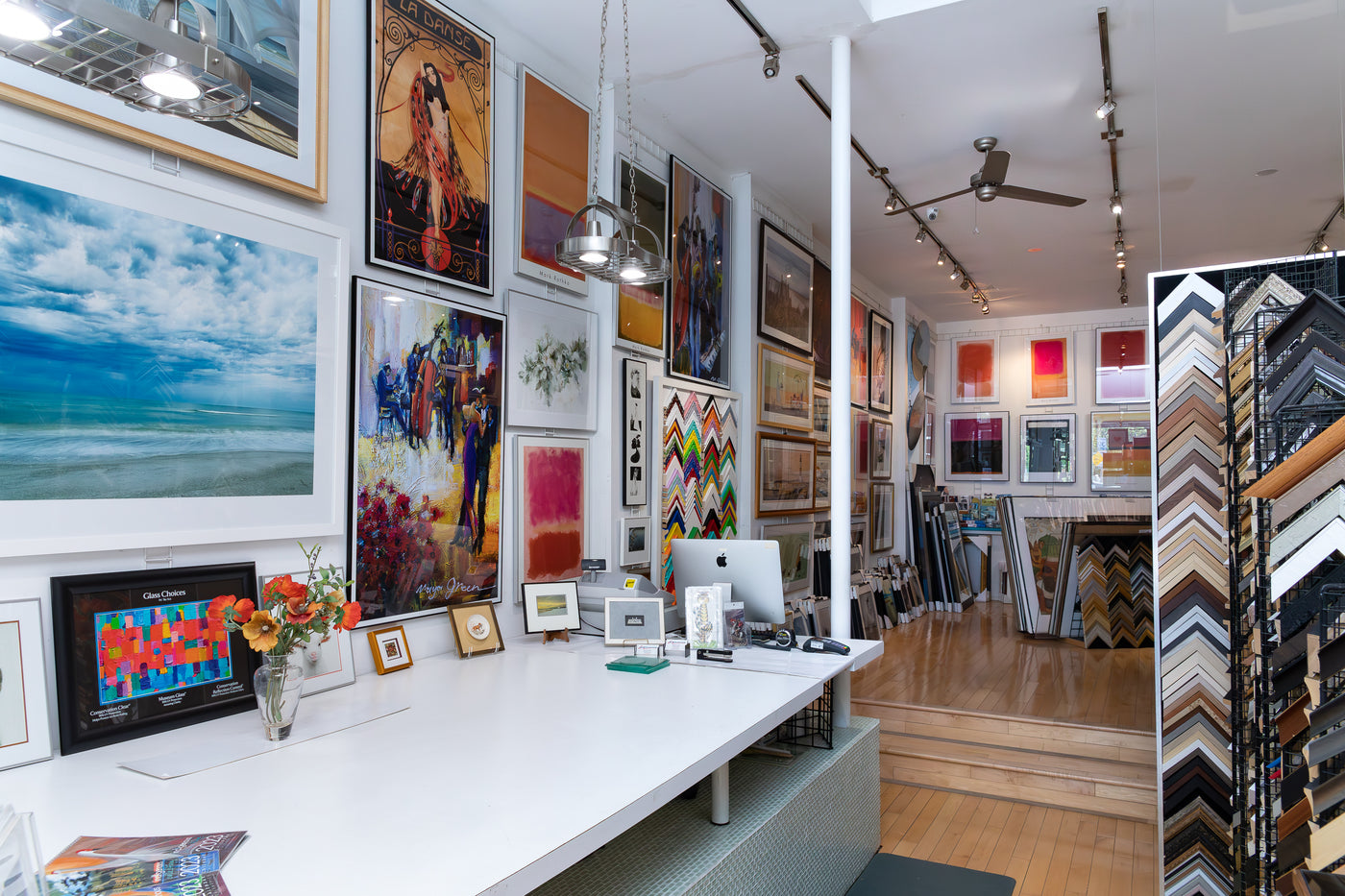 Image of the store with lots of artworks hung to the walls of the interiors.