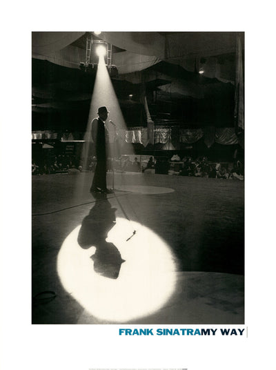 A silhouette of Frank Sinatra on a stage. A spotlight shines down on him, his shadow surrounded by a halo of light. 