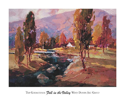 warm fall and pastel coloured trees with a stream flowing in-between and majestic mountains in the background.