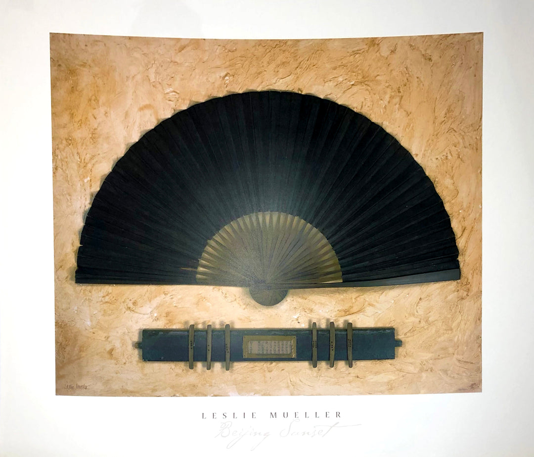 Two black fans, one open above one closed on a wood plank-texture.  Dimensions: 30" x 26"