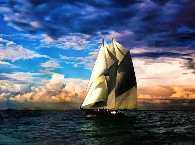 A ship with tall, white sails on open waters. The sky is blue, with indigo clouds and orange clouds closer to the horizon. 