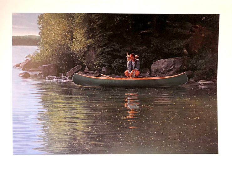 A caucasian man with a red headband and a pack crouches next to a green canoe, which sits on the water next to the rocky shore with trees.  Dimensions: 26.5" x 20" paper / 23" x 15.5" image