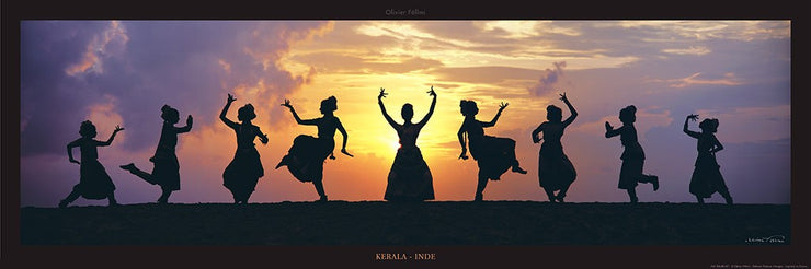 Nine dancers from a dance school in Kerala perform a choreography of the barath natyam called "jugalbandi," diversity in unity. They are silhouetted against the rising/setting sun. Text below image: Kerala - Inde