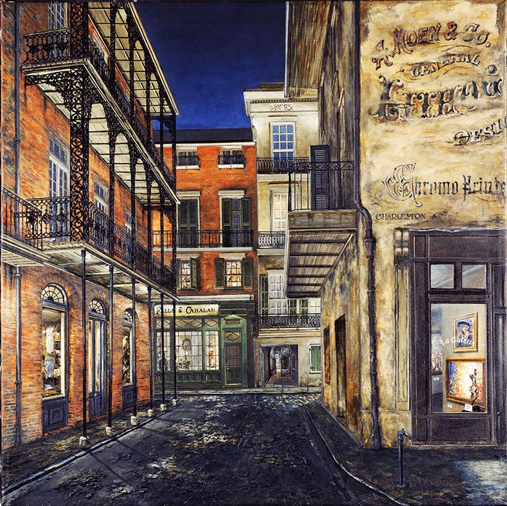 A street by night, with raised balconies and storefronts. Buildings are stone or brick. The cobble road leads to a T in the intersection.