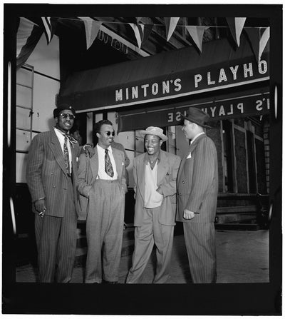 Black and white portrait of Thelonious Monk, Howard McGhee, Roy Eldridge, and Teddy Hill outside of Minton's Playhouse in New York City, N.Y. (1947)