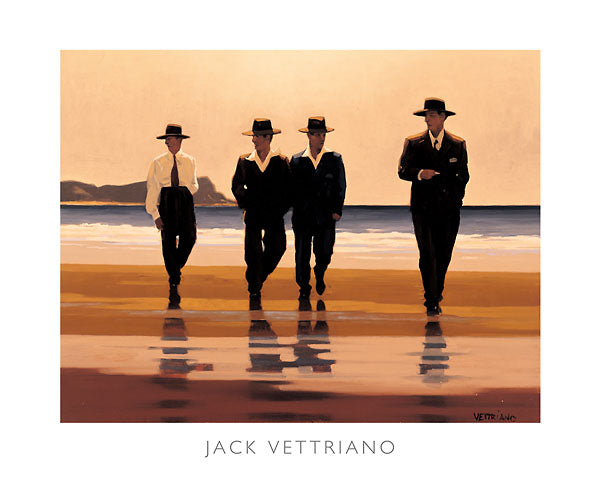Four men walk along a beach in dark hats and pants. Three of them wear suits and ties while one carries his jacket.