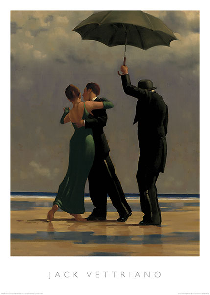 A man in a suit and a woman in a green dress dance on a beach. Another man in a suit and hat holds an umbrella over them.