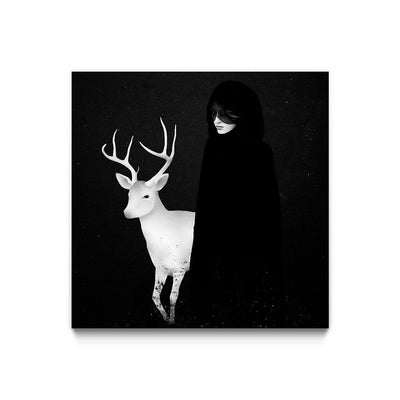 Black and white illustration. A woman in a black dress stands next to a white deer with antlers. Only the woman's face from her nose down is visible, as well as the twinkle in her eyes. They stand against a black background.