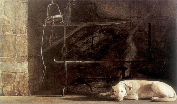 A pale dog lies next to a black cauldron by a stone wall. 