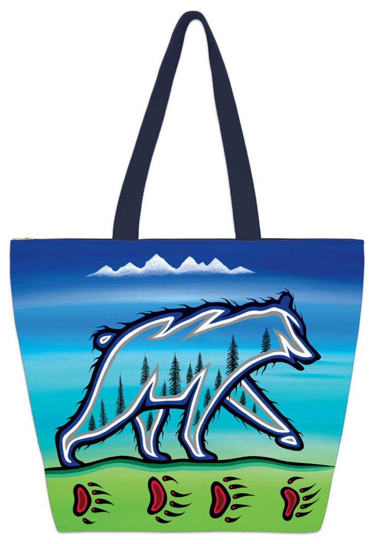 A spectral bear with trees inside it. It walks along ground with bear tracks in it. Set on a tote bag.
