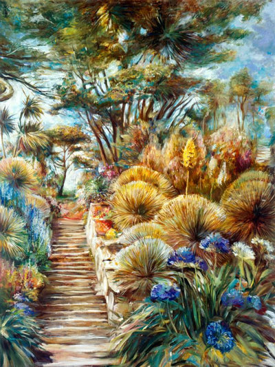 A garden with a variety of vegetation on either side of a series of stairs.
