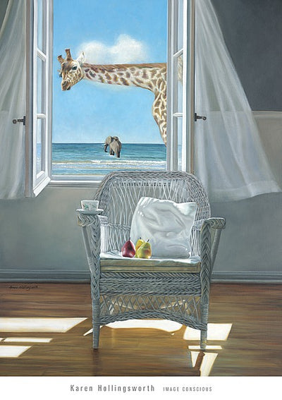 A giraffe looks through a window into a room with a white wicker chair. A white pillow and two pieces of fruit sit on the chair cushion, while a teacup and saucer sit on the arm of the chair. In the distance an elephant walks into the surf of the beach outside the window.