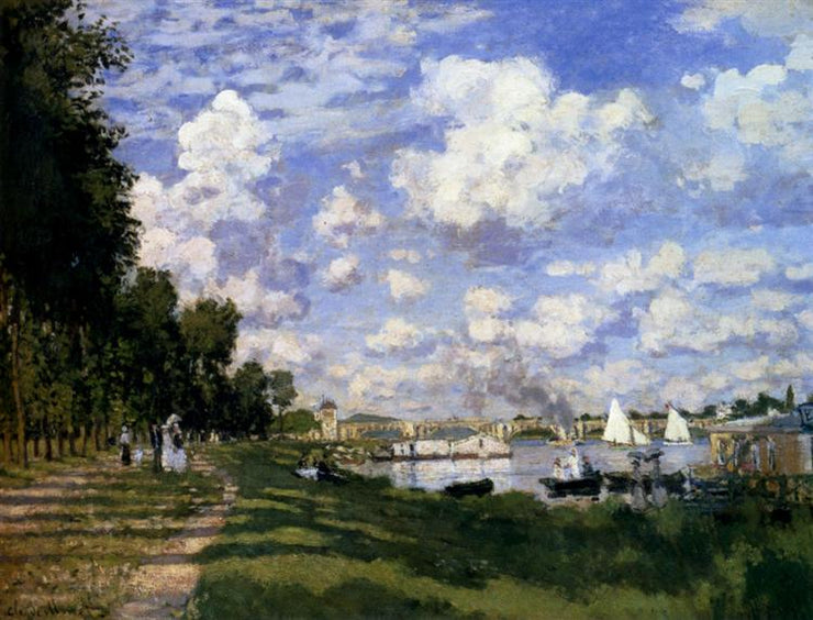 A dirt road by a river under a cloudy, blue sky. People walk around with parasols and sit by the water. Boats sail in the water. A bridge can be seen in the distance. 